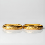 21 Carat Gold Dome Engraved Floral Bangle Pair | 18.180g Total