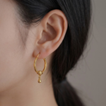 21 Carat Gold Twisted Hoop Earrings with Bead Charm | 2.130g - Image 2