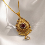 21 Carat Gold Teardrop Locket with Ruby Center Stone | 4.740g