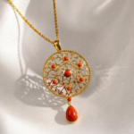 21 Carat Gold Round Filigree Locket with Red Coral Stones | 4.500g