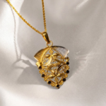 21 Carat Gold Shield Filigree Locket with Black Stone Accents | 1.46g